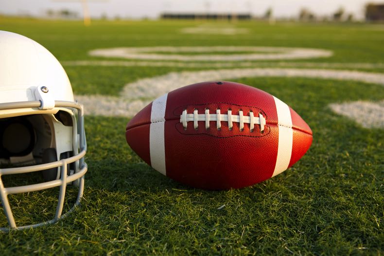 American football helmet and ball