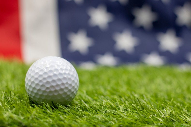 Golf Ball Against Blurred USA Flag